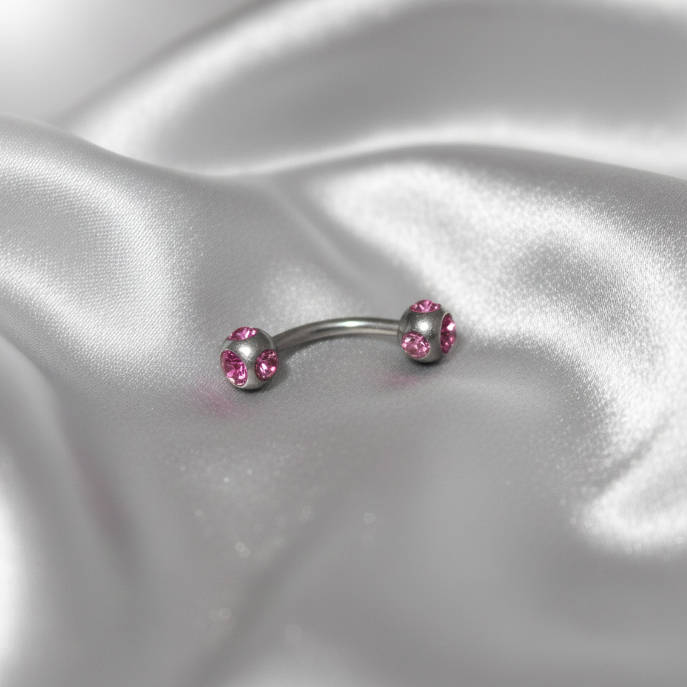 Pink Multi-Crystal Eyebrow Ring in 316l stainless steel.