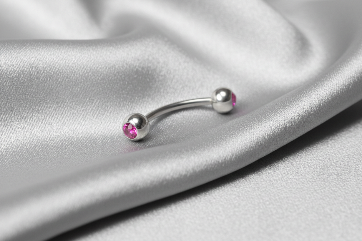 Pink Crystal Ball Eyebrow Ring in 316l stainless steel.