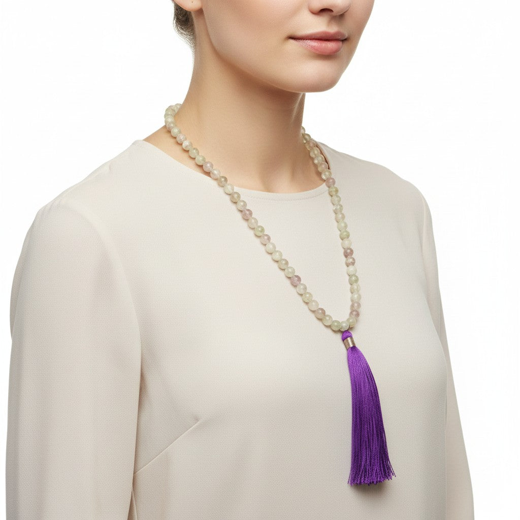 Rainbow Fluorite Bead Mala with Purple Silk Tassel around the neck of a female model worn as a necklace.