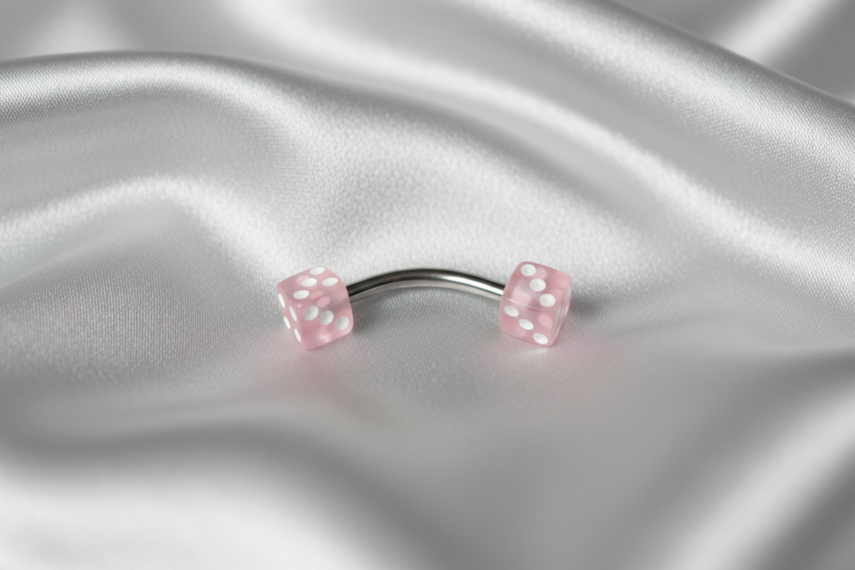 Light Pink Acrylic Dice Eyebrow Ring in 316l stainless steel.