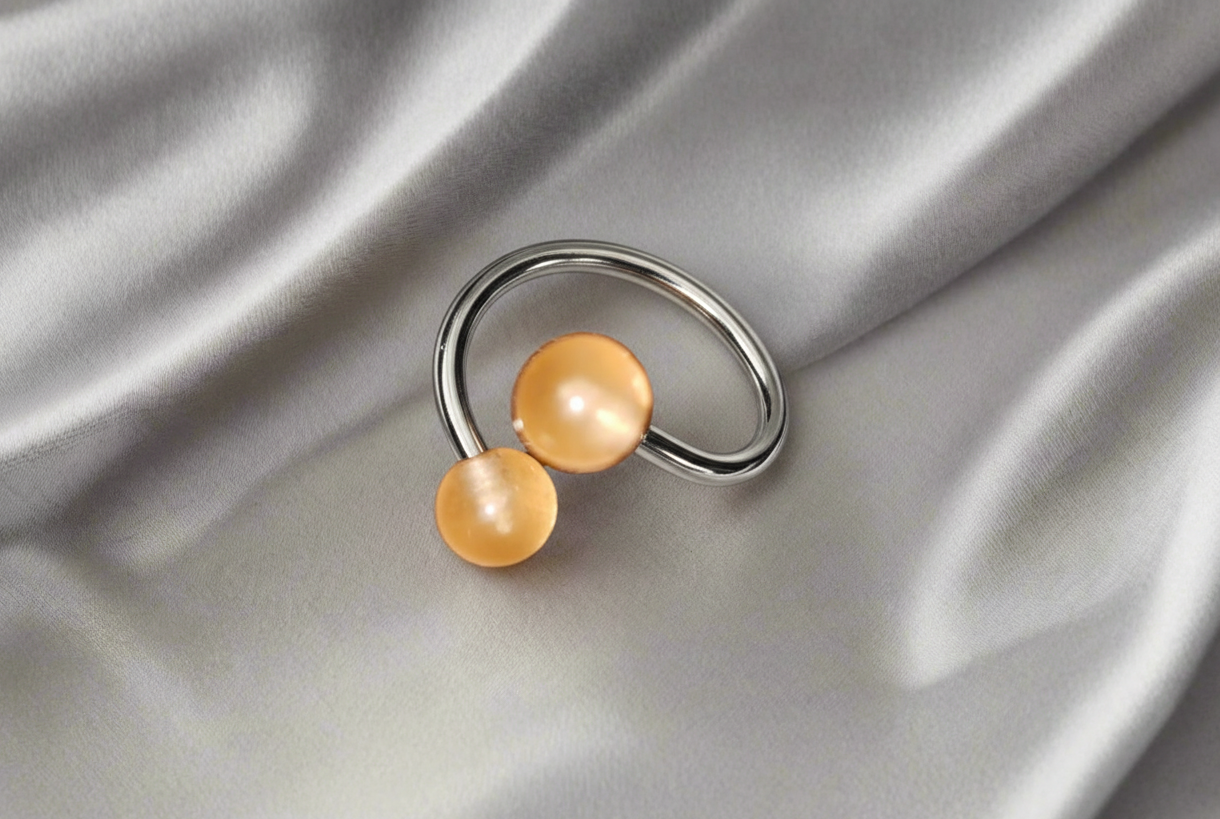 Orange Acrylic Glow Curled Barbell - 316L Stainless Steel.