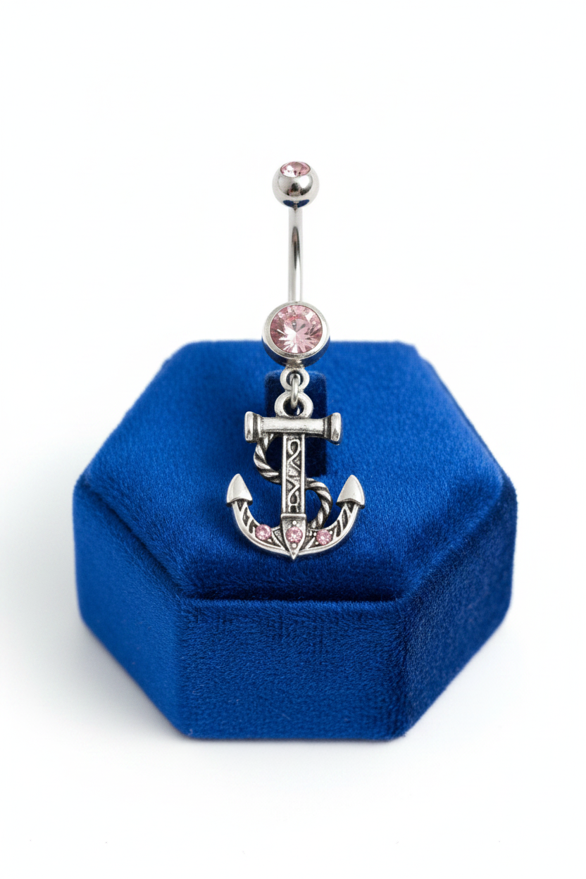 Pink Crystal Anchor Belly Button Ring in 316l stainless steel on a blue velvet jewelry display