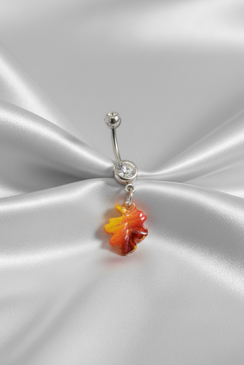 Clear Crystal Maple Leaf Belly Button Ring in 316l stainless steel.