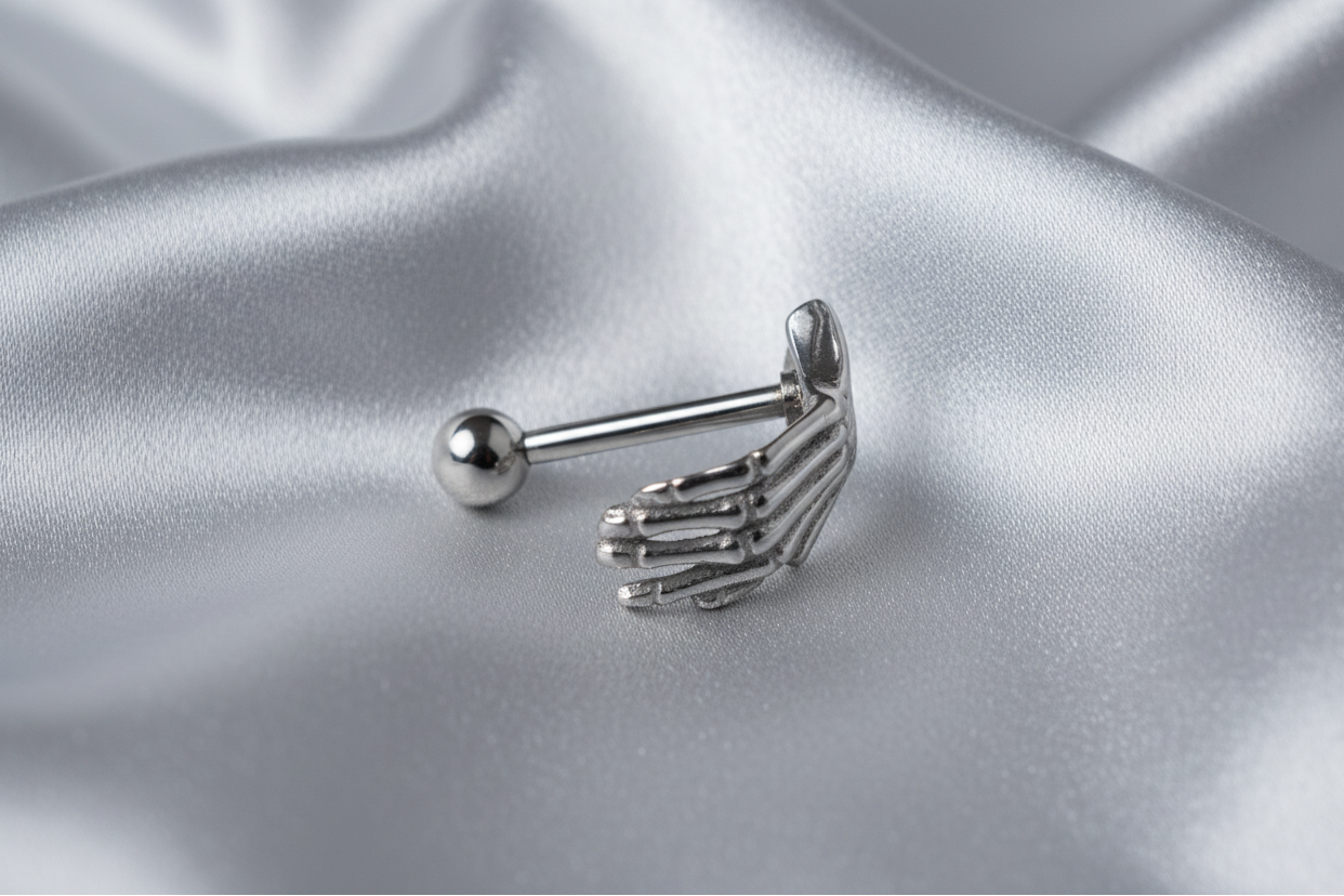 Steel Skeleton Hand Eyebrow Ring in 316l stainless steel.