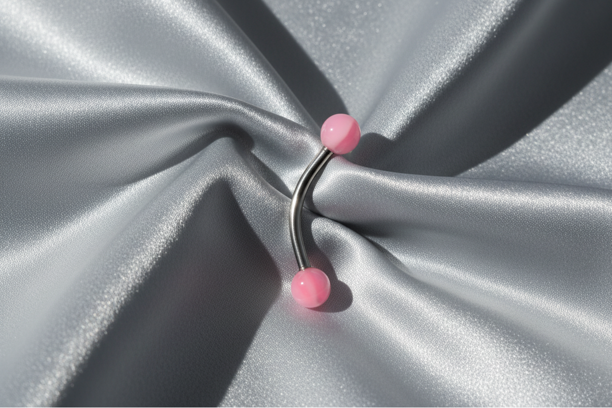 Pink and White Acrylic Eyebrow Ring in 316l stainless steel.