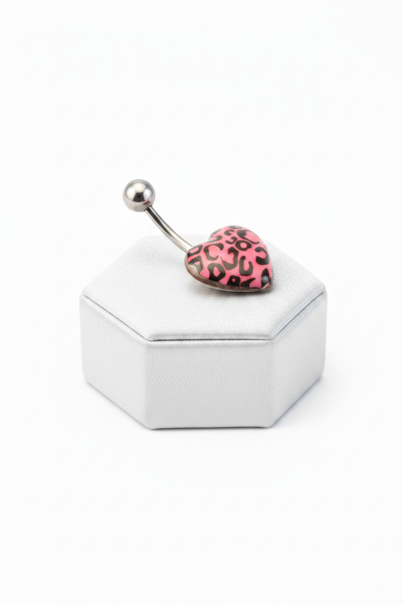 Pink Leopard Print Heart Acrylic Belly Button Ring in 316l stainless steel on a silver silk jewelry display side profile.