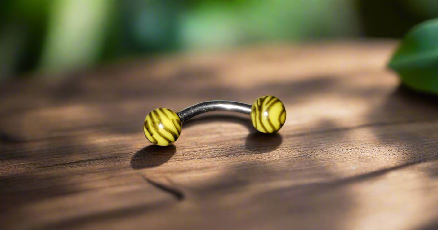 Steel Eye Brow Piercing Yellow & Black Tiger Striped