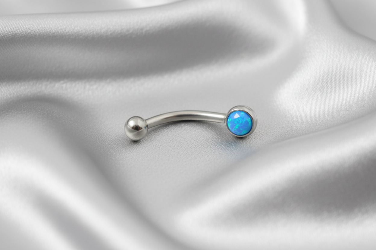 Aqua Opal Flat Head Top Eyebrow Ring in 316l stainless steel.