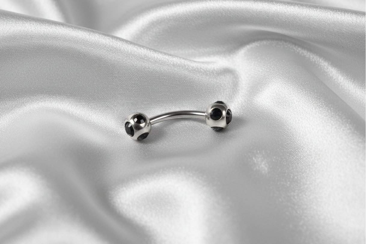 Black Multi-Crystal Eyebrow Ring in 316l stainless steel.