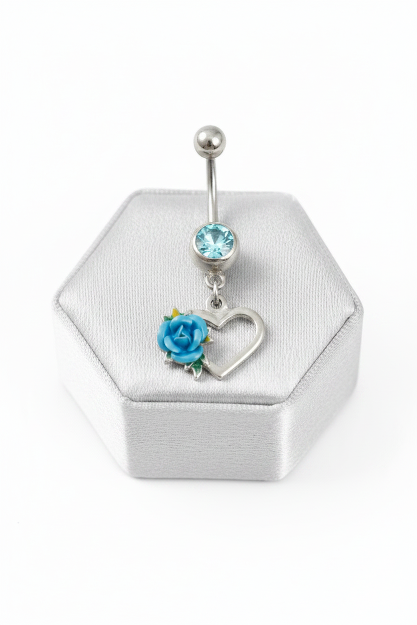 Aqua Crystal Rose Heart Belly Button Ring in 316l stainless steel on a silver silk jewelry display close up detail.
