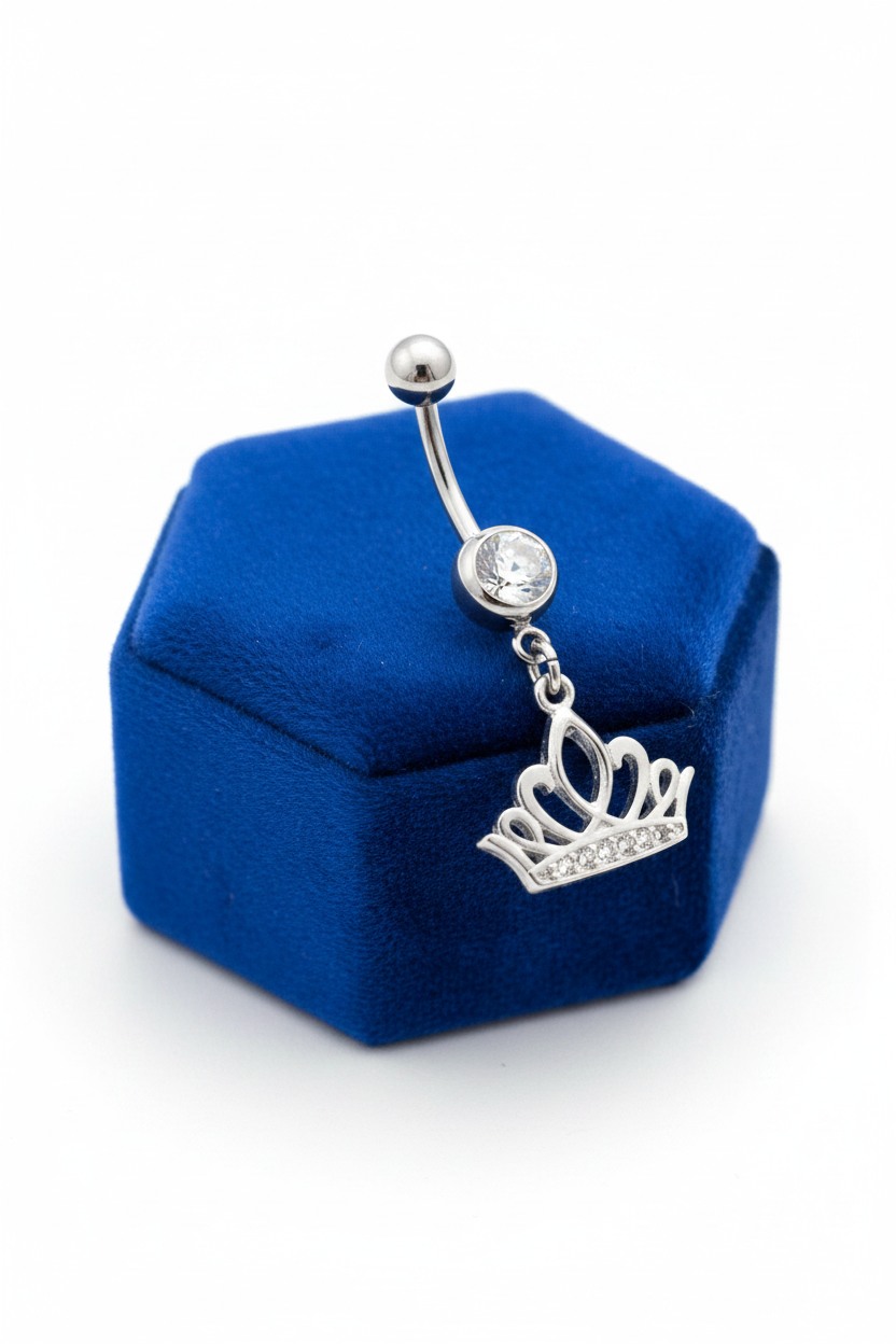 Clear Crystal Crown Belly Button Ring in 316l stainless steel on a blue velvet jewelry display.