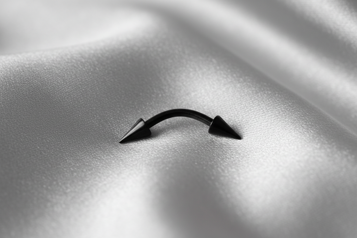 Black Titanium Spike Eyebrow Ring in black titanium.