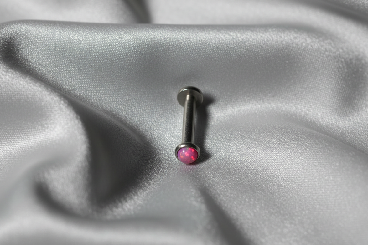 Internally Threaded Light Pink Opal Labret Lip Ring in 316l stainless steel.