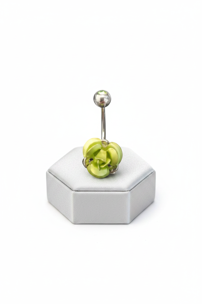 Green Rose Belly Button Ring in 316l stainless steel on a silver silk jewelry display.