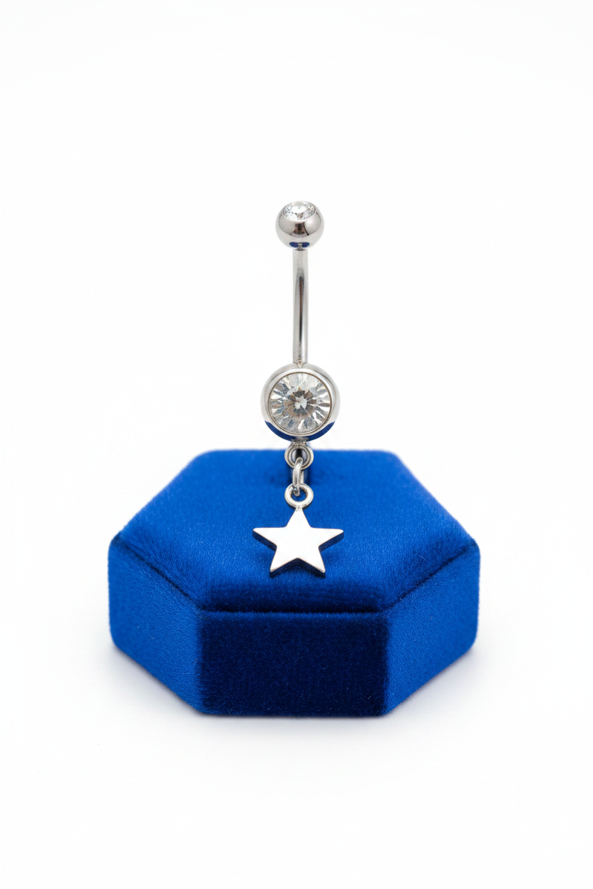 Clear Crystal Sterling Silver Star Belly Button Ring in 316l stainless steel on a blue velvet jewelry display.