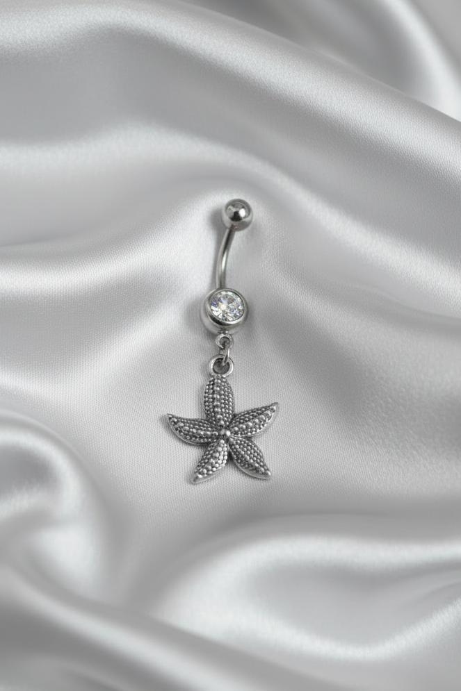 Clear Crystal Star Fish Belly Button Ring in 316l stainless steel.