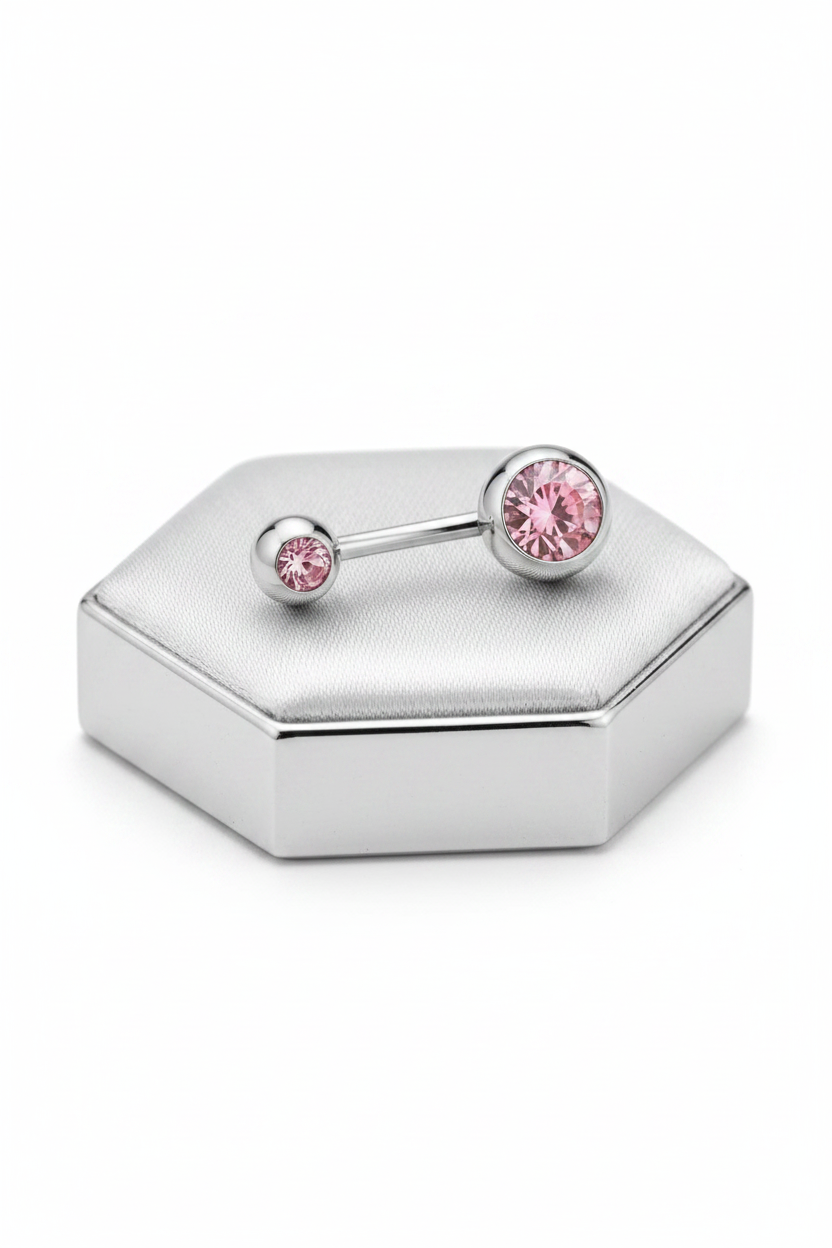 Pink Crystal Belly Button Ring in 316l stainless steel on a silver jewelry display side profile view.