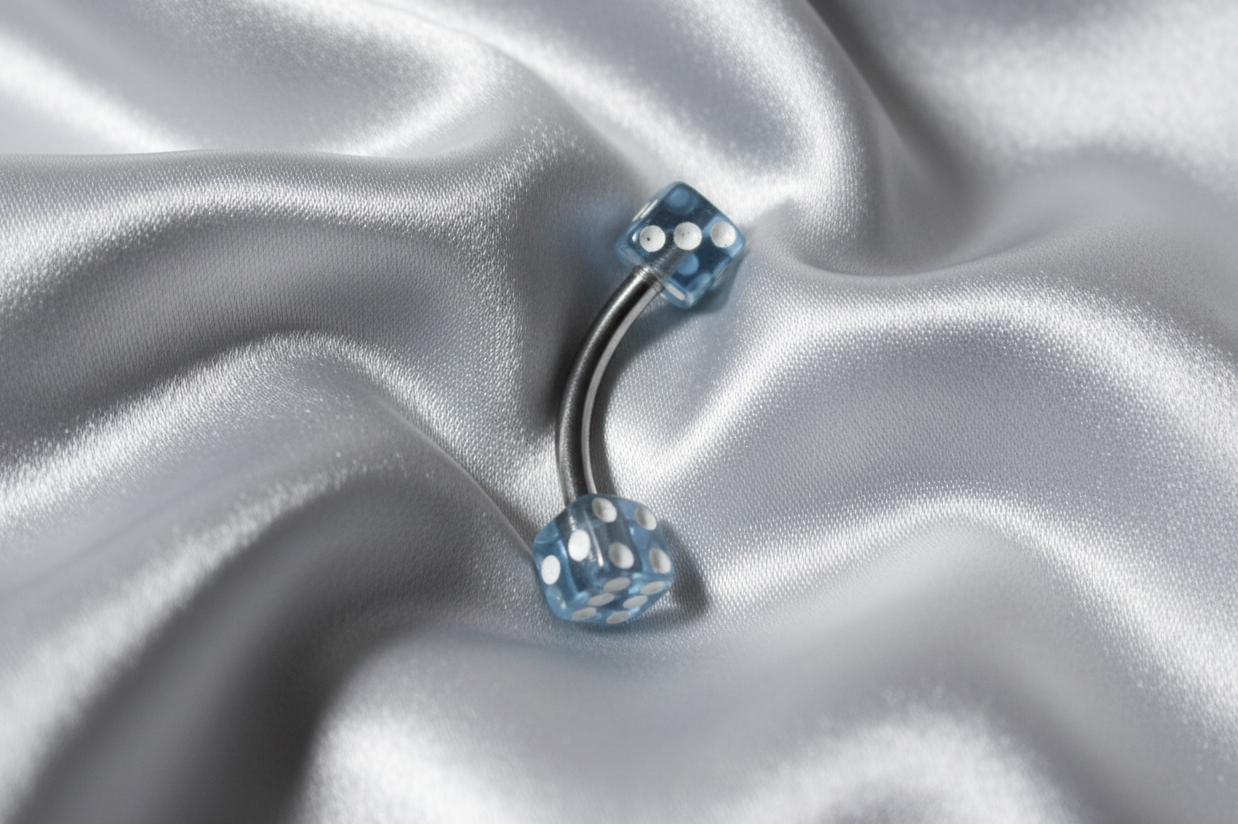 Baby Blue Acrylic Dice Eyebrow Ring in 316l stainless steel.