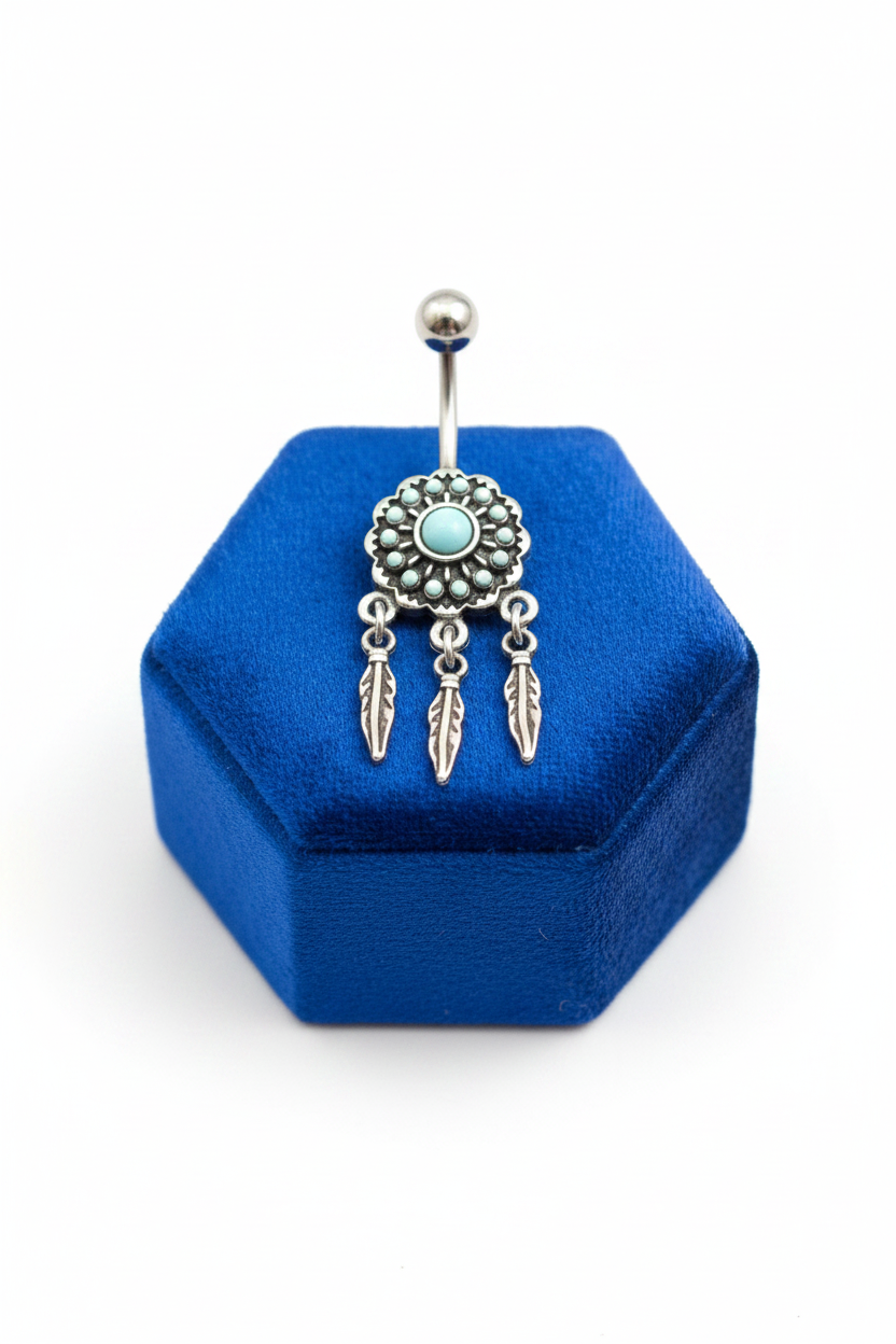 Turquoise Dream Catcher Belly Button Ring in 316l stainless steel on a blue velvet jewelry display.