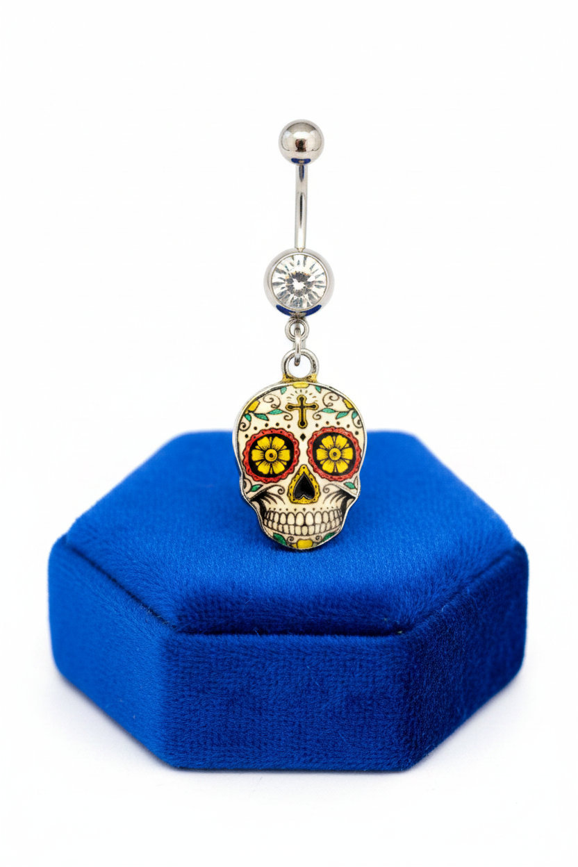 Clear Crystal Sugar Skull Belly Button Ring in 316l stainless steel on a blue velvet jewelry display.