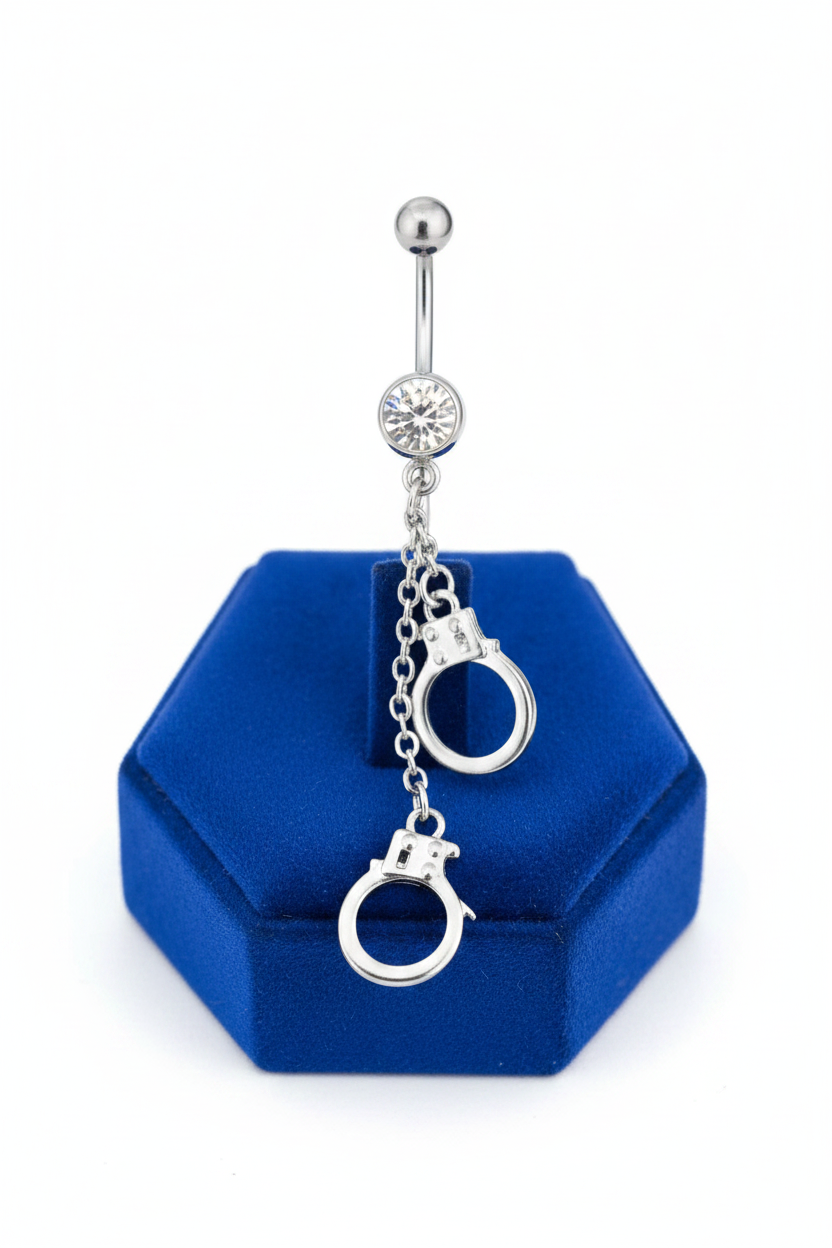 Clear Crystal Handcuff Belly Button Ring in 316l stainless steel on a blue velvet jewelry display.
