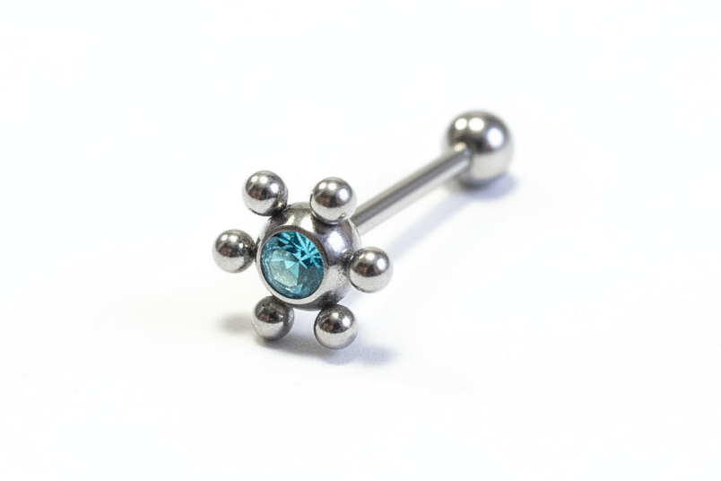 Aqua Crystal Decorative Tongue Barbell in 316l stainless steel in close up detail.