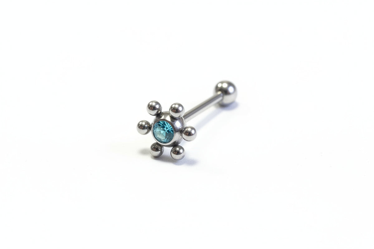 Aqua Crystal Decorative Tongue Barbell in 316l stainless steel on a white background.
