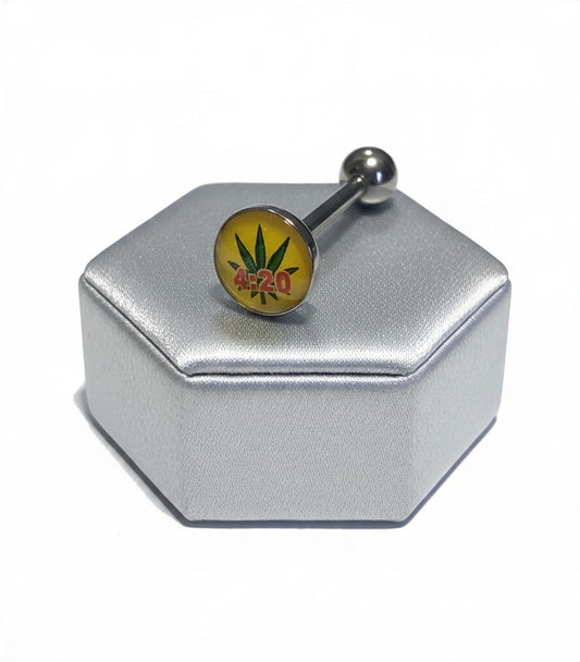 Rastafarian Green Leaf Tongue Barbell in 316l stainless steel on a silver silk jewelry display.