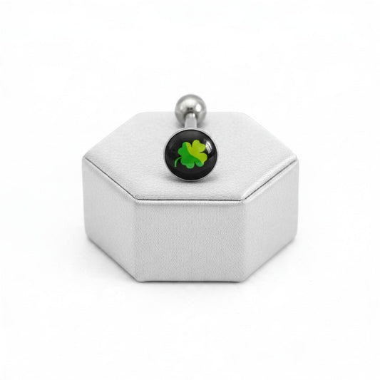 Lucky Clover Tongue Barbell in 316l stainless steel on a silver silk jewelry display.