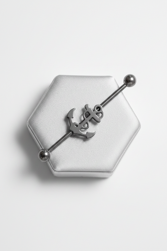 Anchor Industrial Ear Barbell in 316l stainless steel on a silver silk  jewelry display.
