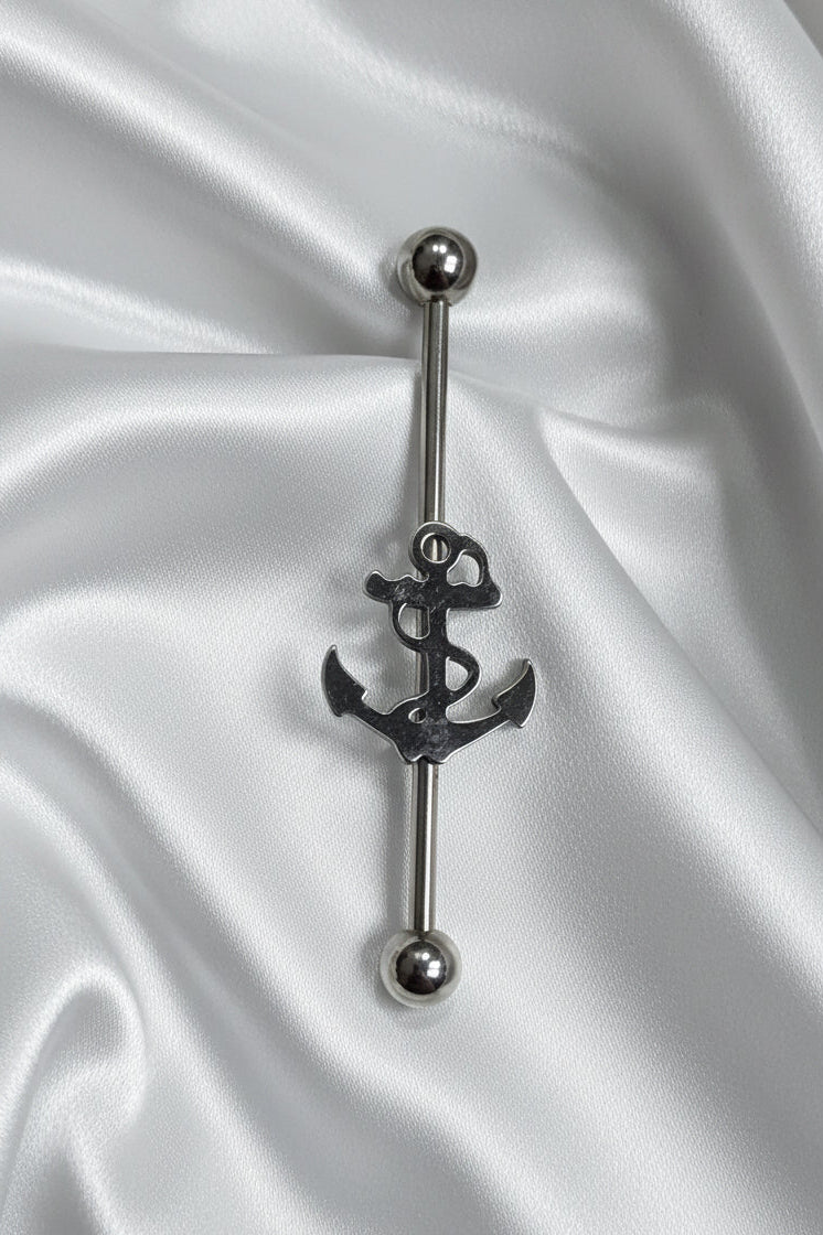 Anchor Industrial Ear Barbell in 316L stainless steel upright position on silver silk fabric.