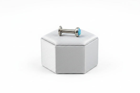 Internally Threaded Aqua Opal Labret Lip Ring in 316l stainless steel n a silver silk jewelry display.