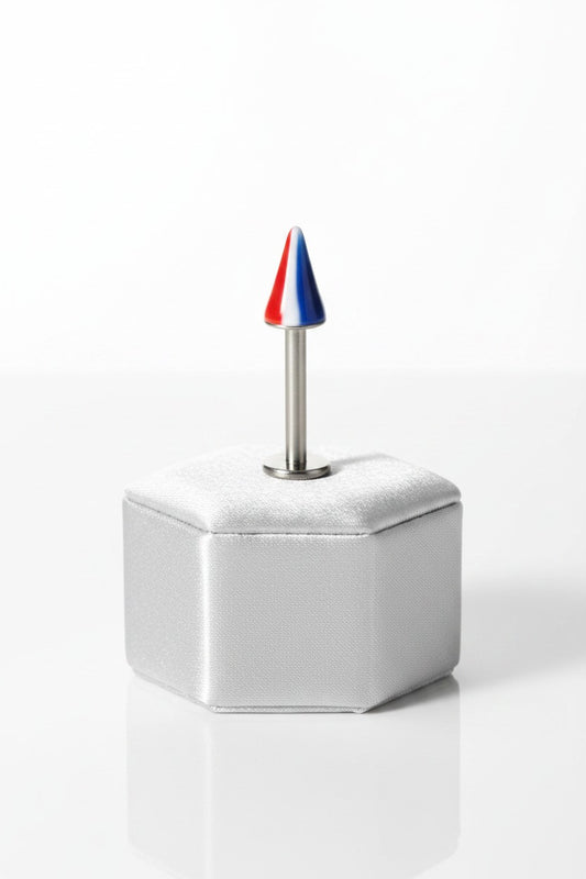 Striped Acrylic Spike Labret Lip Ring in 316l stainless steel on a silver silk jewelry display.