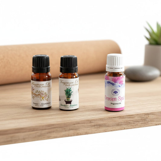 Dream of Abundance Essential Oil Blends 3 Pack Special on a wooden counter in a yoga studio.