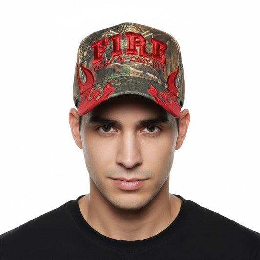 First In Last Out Fire and Flames Firefighter Adjustable Camouflage Baseball Cap with a white background on a male model front profile.