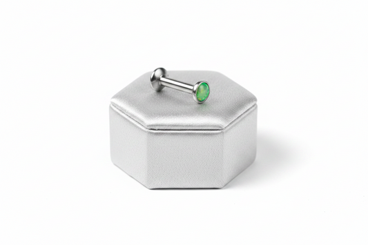 Internally Threaded Light Green Opal Labret Lip Ring in 316l stainless steel on a silver silk jewelry display.