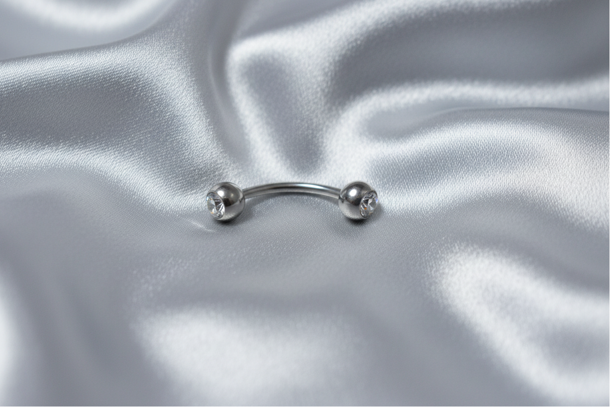 Clear Crystal Ball Eyebrow Ring in 316l stainless steel.