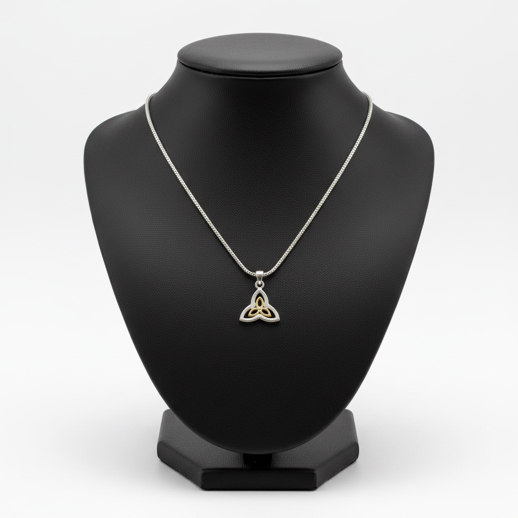 Gold Plated Triquetra Steel Chain Necklace in 316l stainless steel on a black bust with a white background.