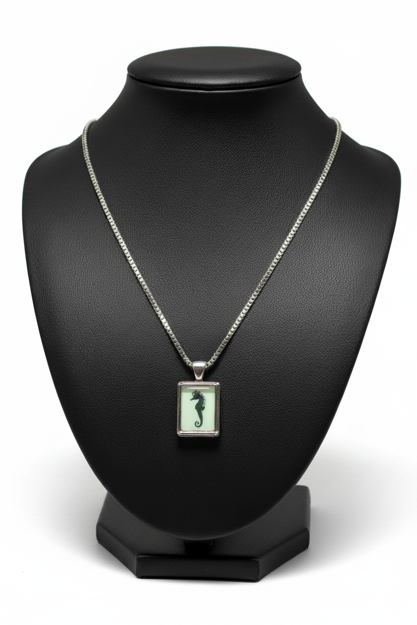 Vintage Seahorse Steel Chain Necklace in 316l stainless steel on a black bust with a white background.