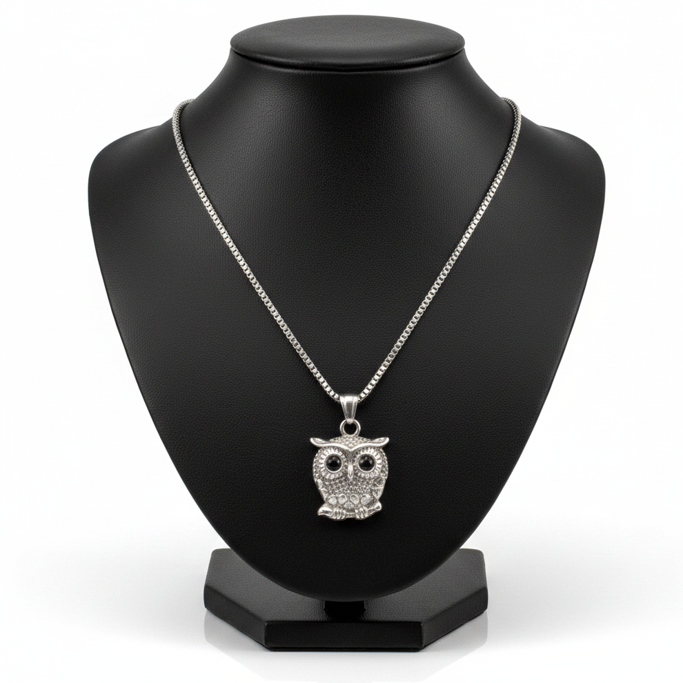 Sitting Owl Steel Chain Necklace in 316l stainless steel on a black bust with a white background.