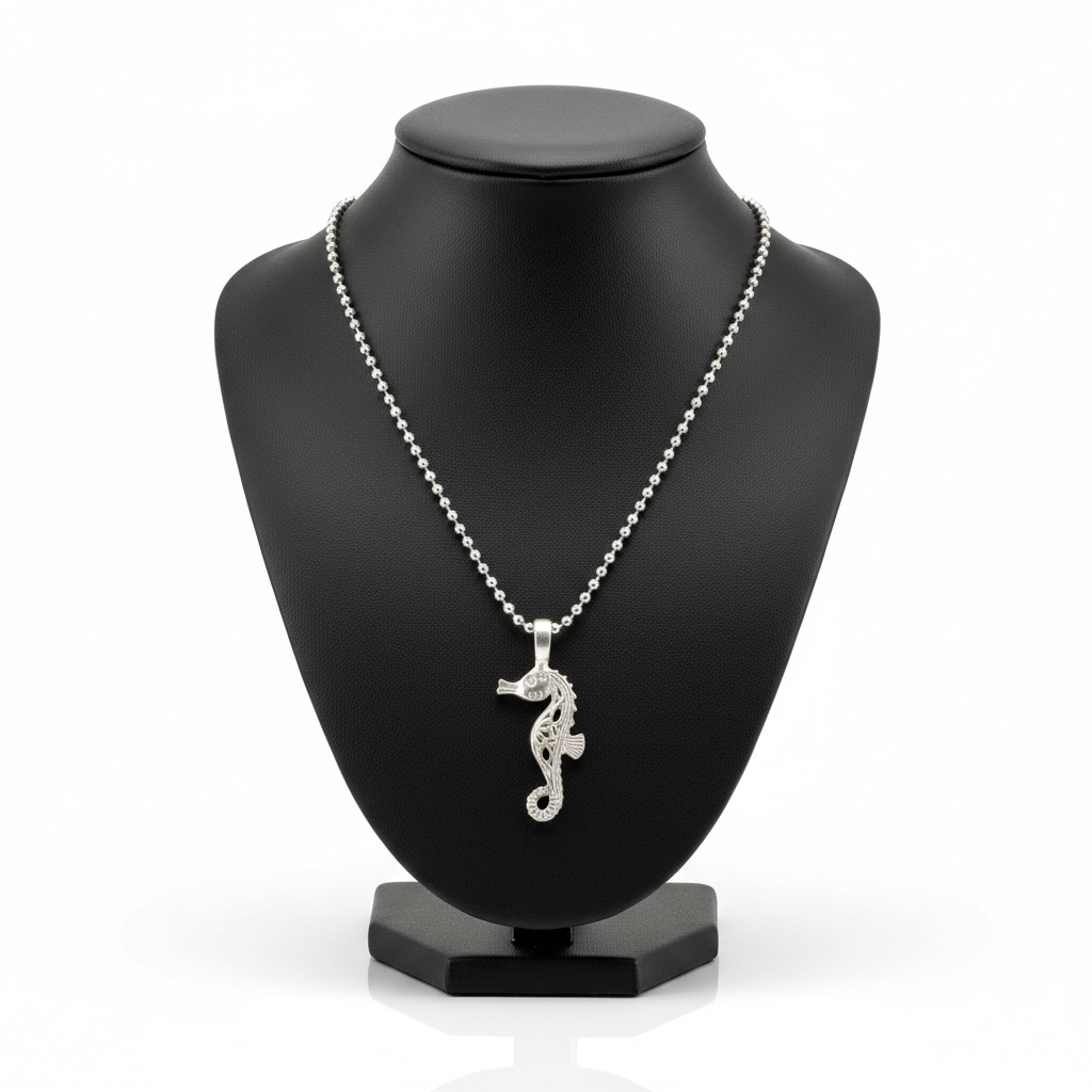Seahorse Steel Chain Necklace in 316l stainless steel on a black bust with a white background.