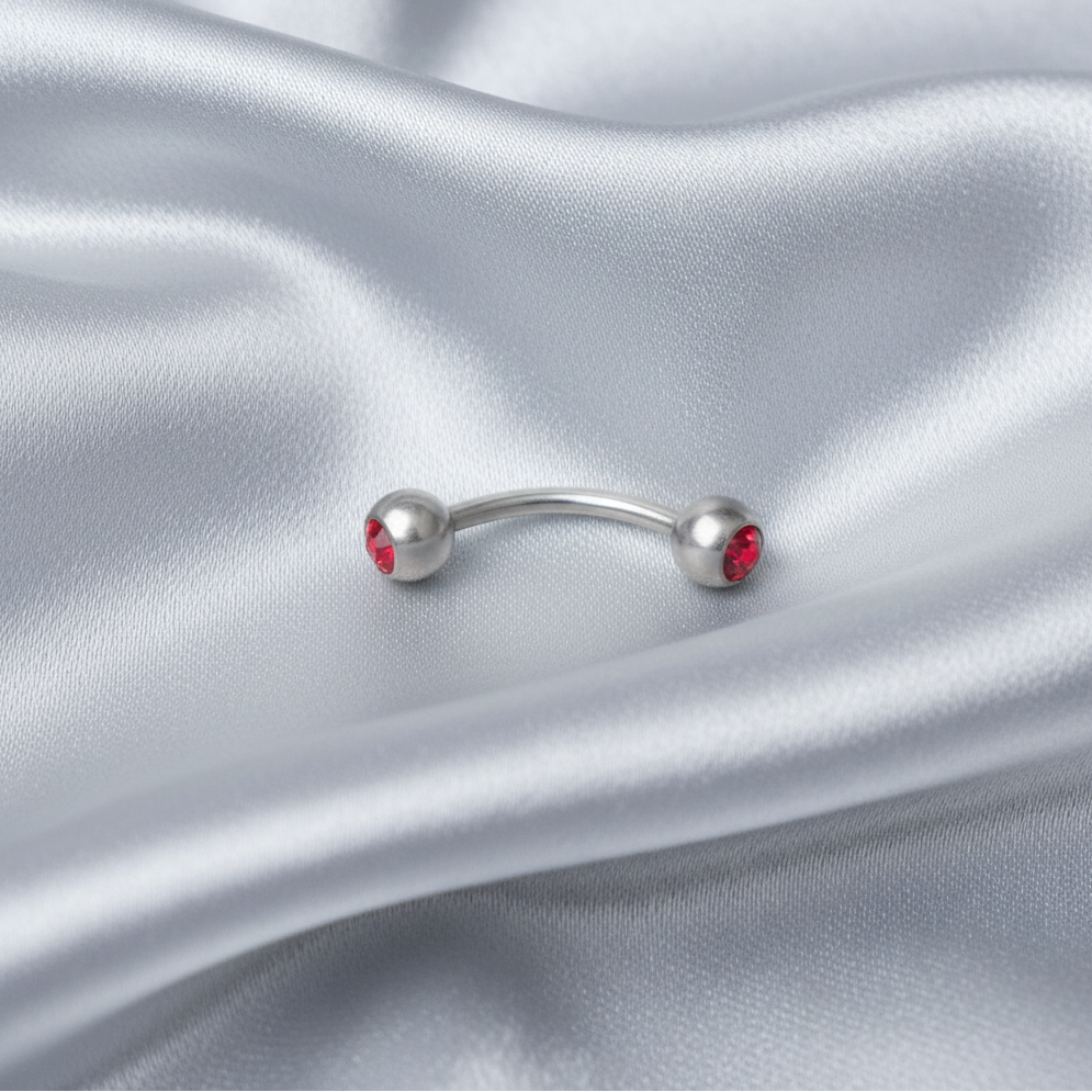 Red Crystal Ball Eyebrow Ring in 316l stainless steel.