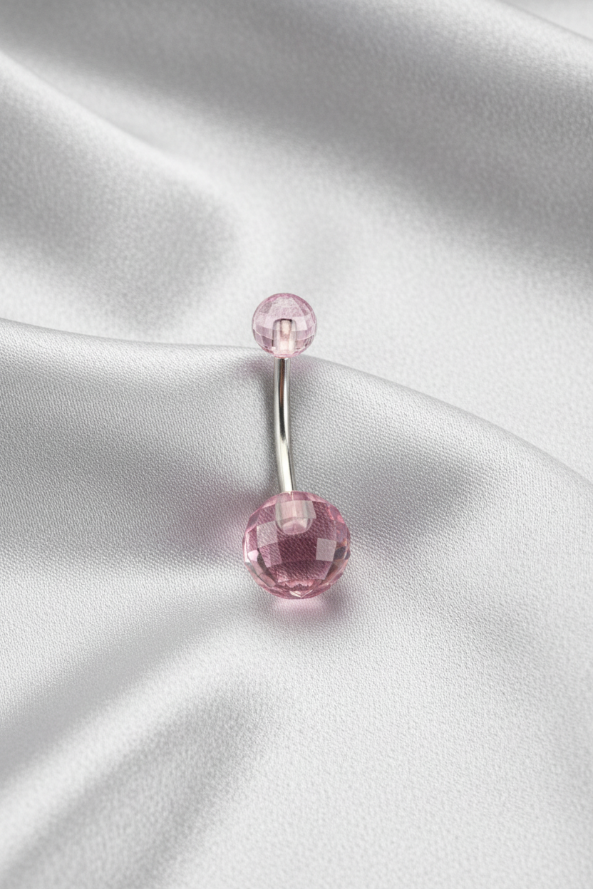 Purple Acrylic Disco Ball Belly Button Ring in 316l stainless steel on silver silk fabric.