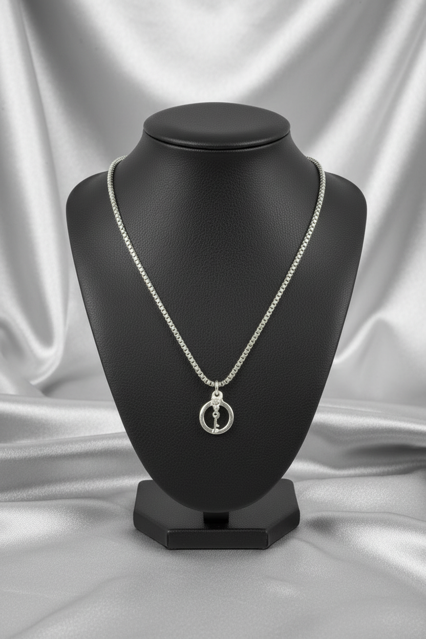 Handcuff with Key Steel Chain Necklace in 316l stainless steel on a black bust.