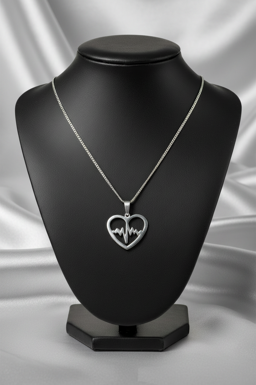 Erratic Heartbeat Steel Chain Necklace in 316l stainless steel on a black bust.