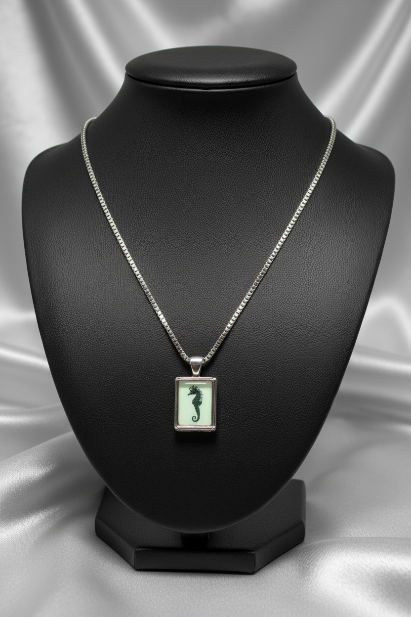 Vintage Seahorse Steel Chain Necklace in 316l stainless steel on a black bust.