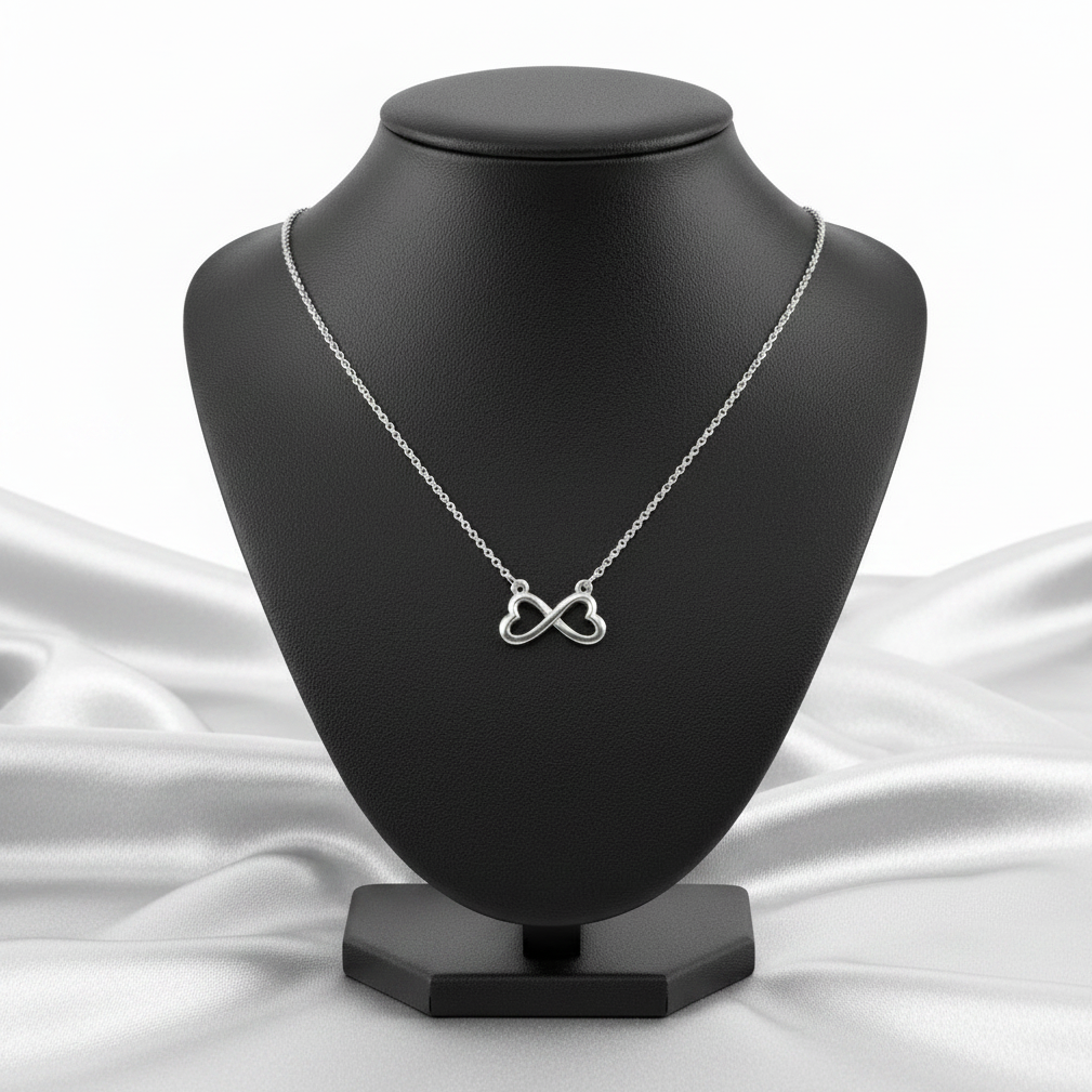 Infinity Hearts Steel Chain Necklace in 316l stainless steel on a black bust.