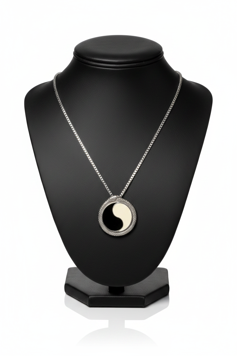 Serpentine Yin Yang Steel Chain Necklace in 316l stainless steel on a black bust with a white background.