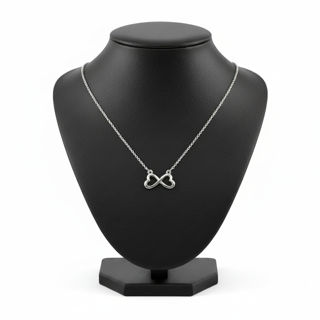 Infinity Hearts Steel Chain Necklace in 316l stainless steel on a black bust with a white background.