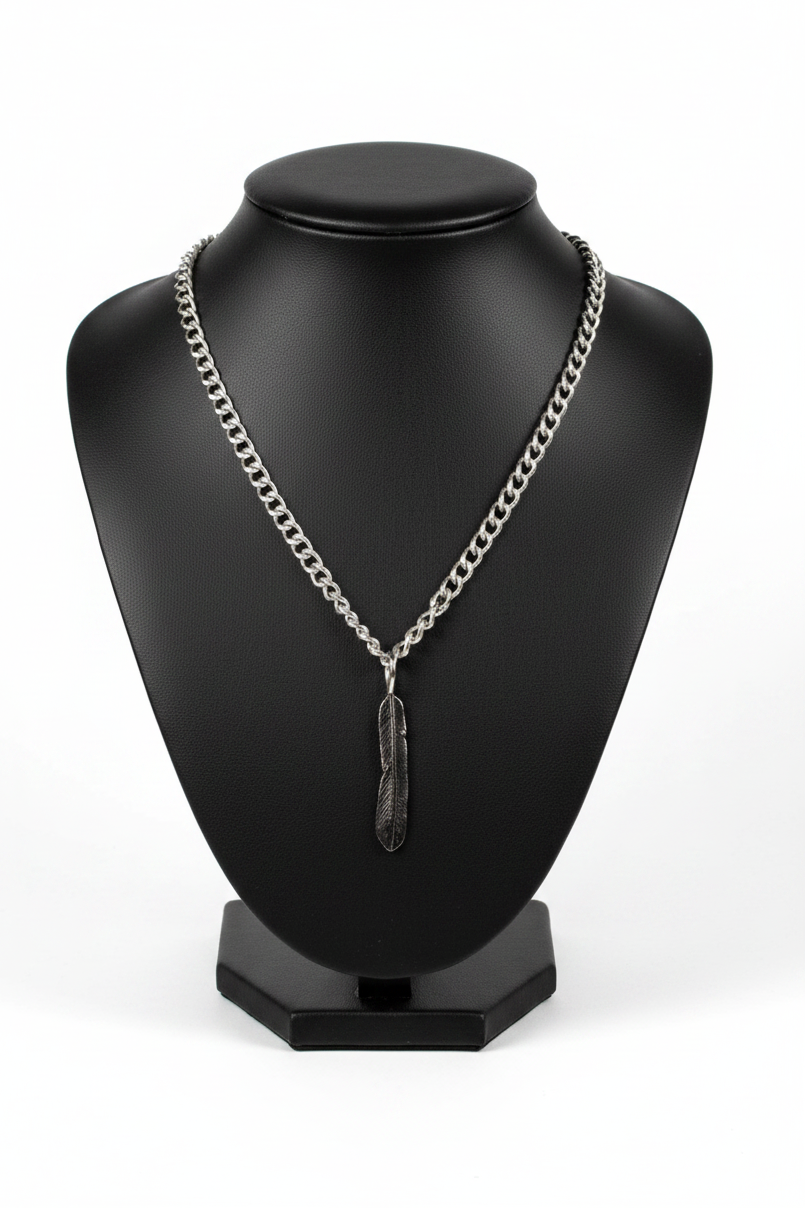 Feather Steel Chain Necklace in 316l stainless steel on a black bust with a white background.